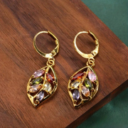 Retro Golden Leaf Earrings Adorned with Vibrant Zirconia