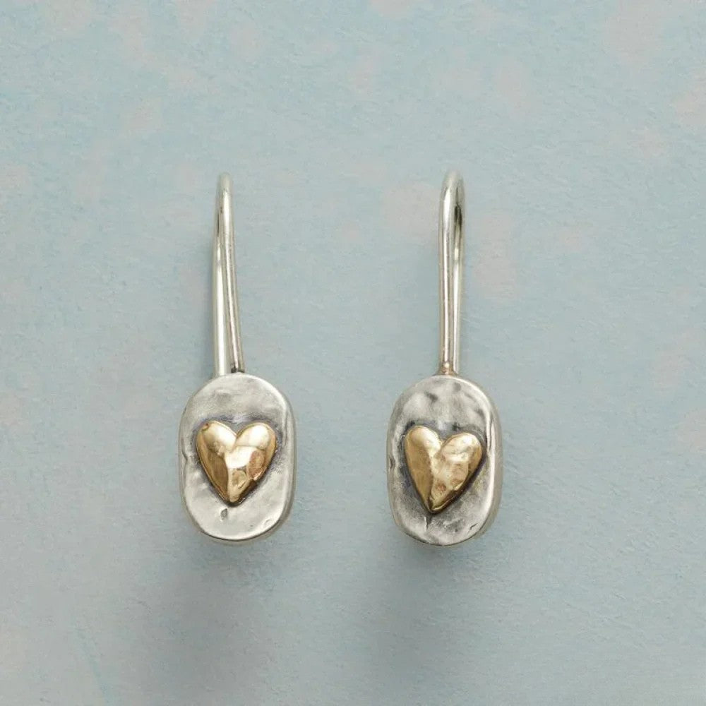 Antique Silver Earrings Featuring a Golden Heart